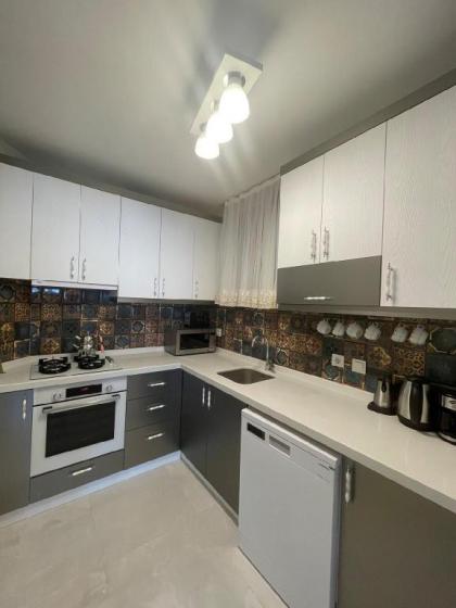 The New Cozy Apartment Atakoy - image 10